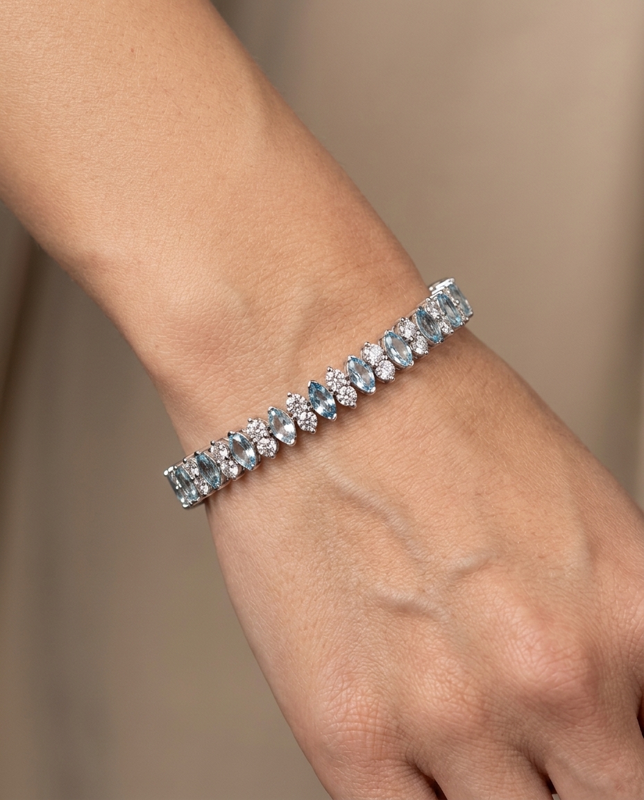 14KT White Gold Marquise Shape Aquamarine and Diamonds Tennis Bracelet on model