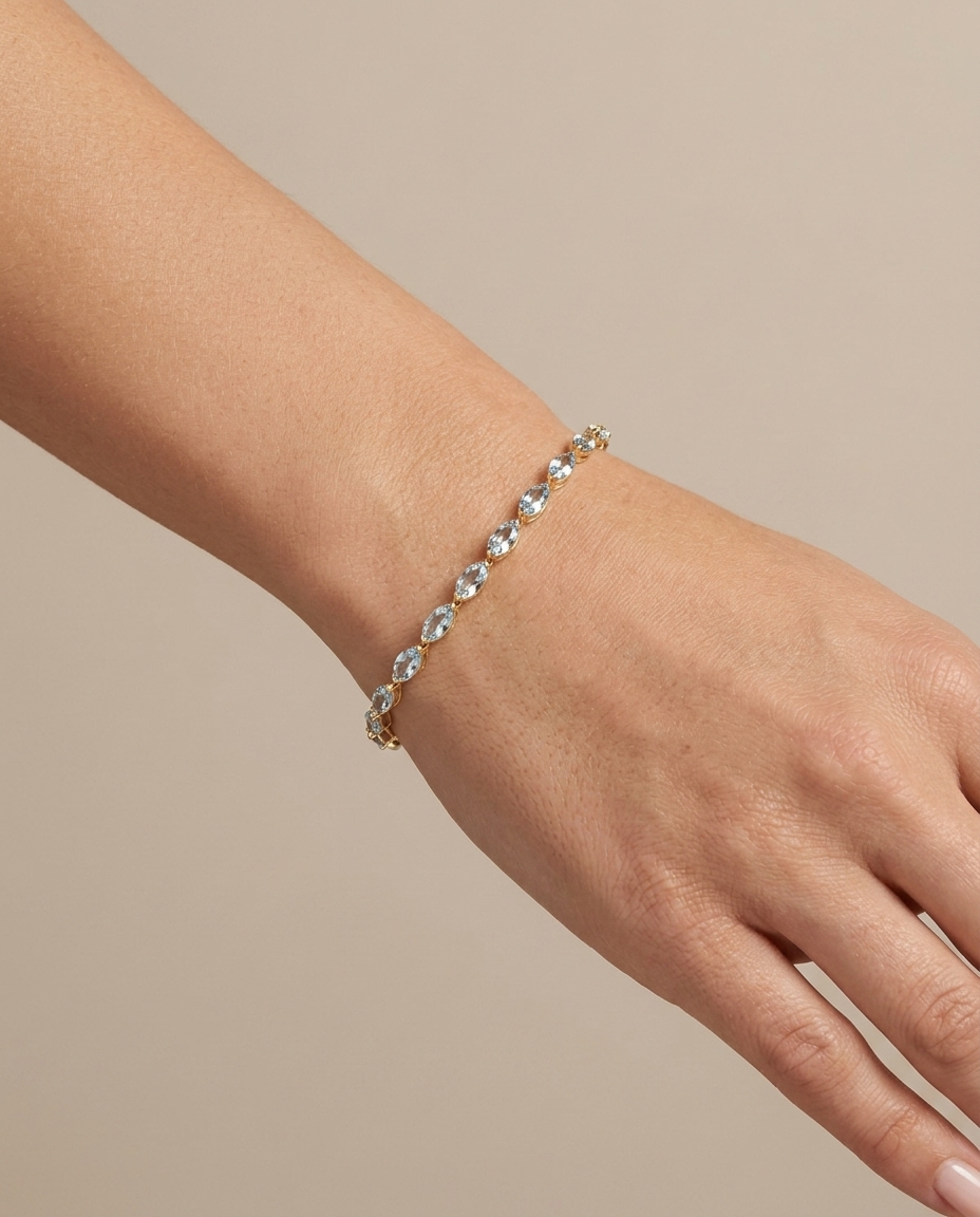 14KT Gold Marquise Shape Aquamarine Tennis Bracelet on model