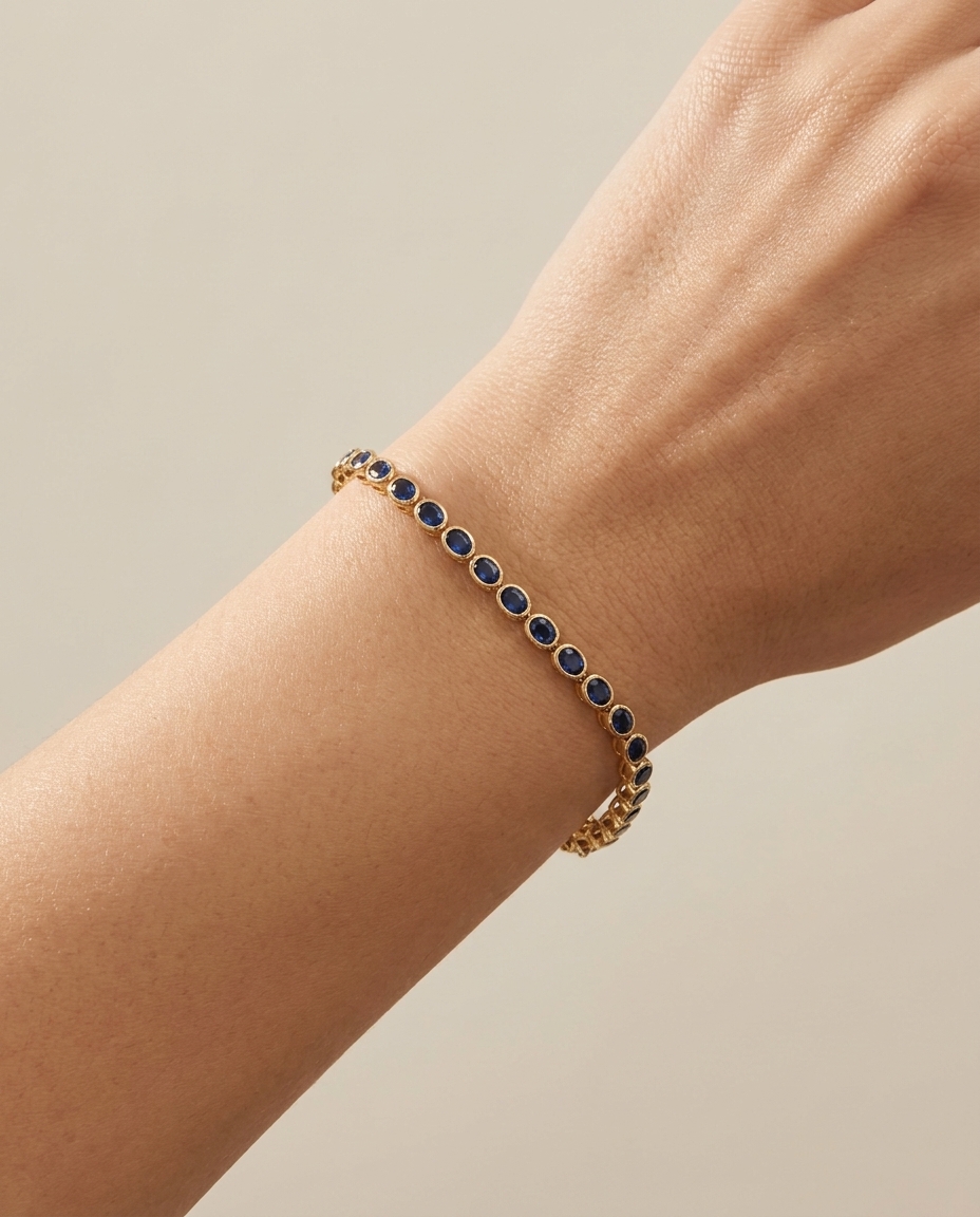 14KT Yellow Gold Oval Shape Bezeled Sapphire Bracelet on model