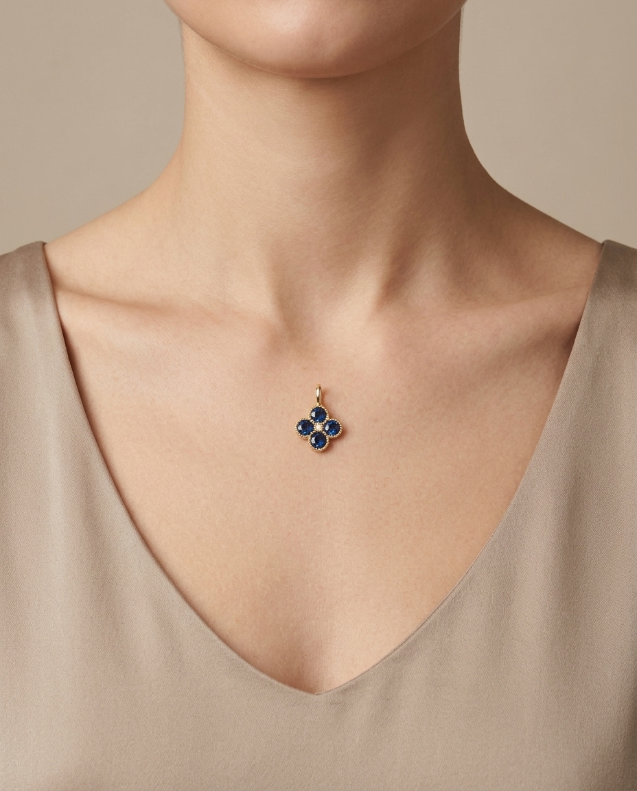 14KT Gold Blue Sapphire Clover Pendant on model