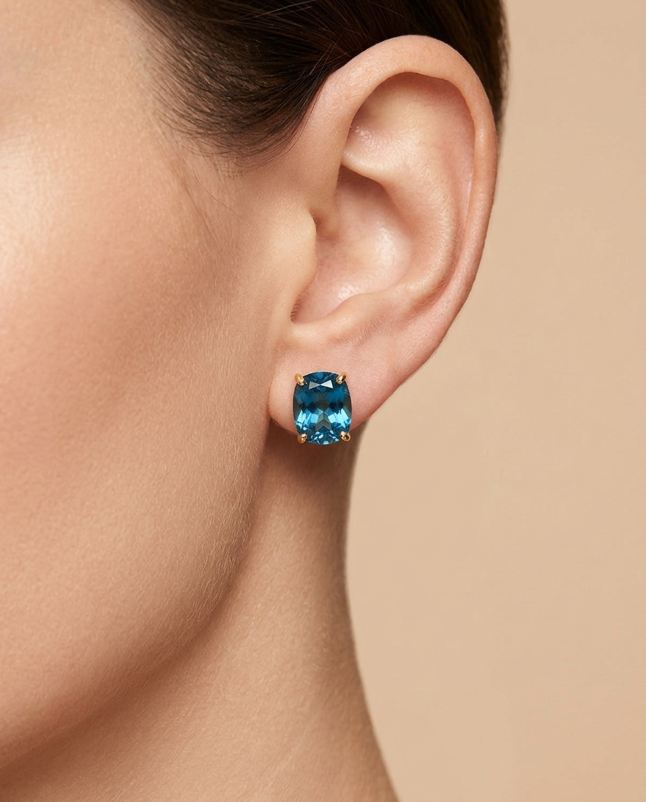 14KT Yellow Gold Blue Topaz Earring Studs on model