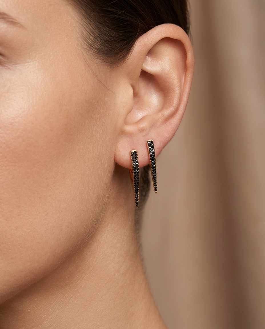14KT Gold Black Diamond Spike Huggies on model