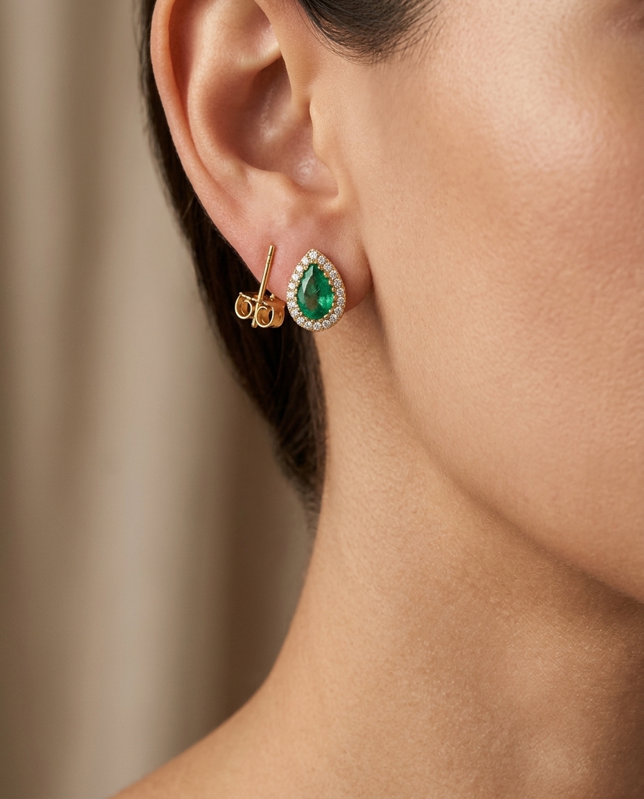 14KT Yellow Gold Emerald and Diamonds Pear Shape Earing on model