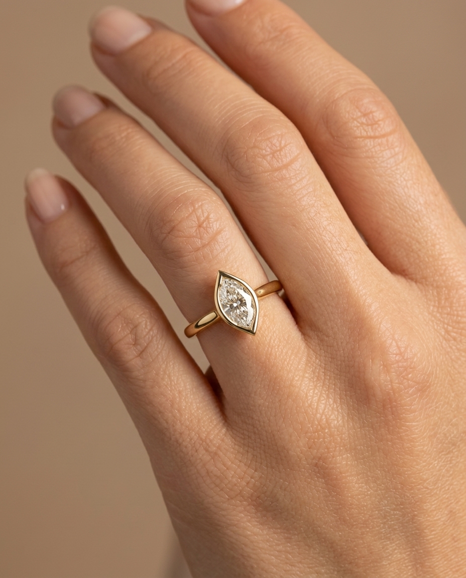 14KT Gold Ring with Single Bezeled Marquise Shape Diamond on model