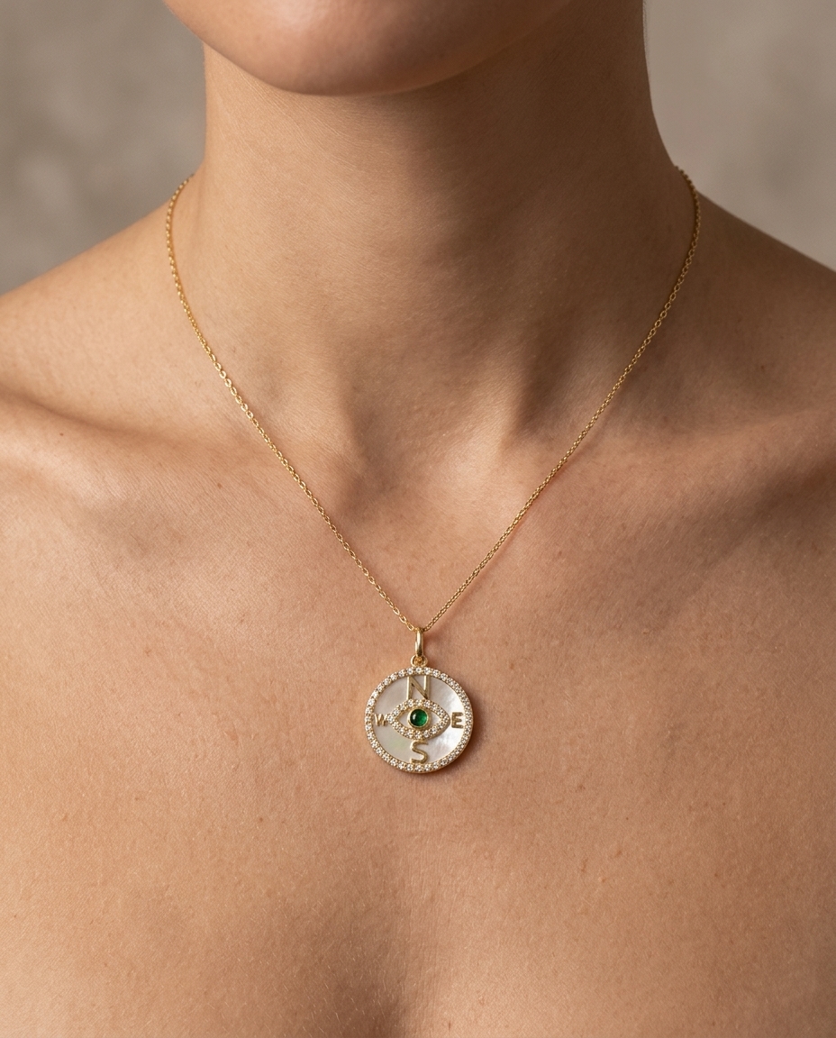 14KT Yellow Gold Mother of Pearl and Emerald Evil Eye Compass Pendant with Diamonds on model
